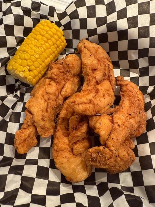 Seafood boil trays on a table.